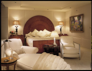 This luxurious bedroom features upholstered walls in ivory silk.